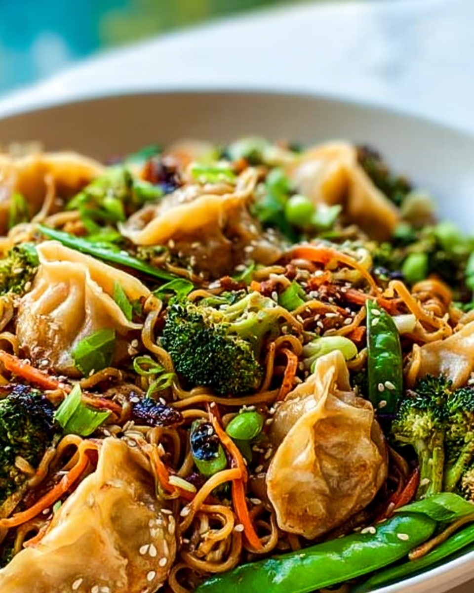 A close-up view of a large serving of stir-fried noodles piled high, showing a mix of textures and bright colors. The base layer is light brown noodles mixed with shiny green pieces of broccoli and snap peas. On top, there are orange julienned carrots and dark green leafy vegetables. Scattered throughout are several golden brown fried dumplings with a slightly crispy texture. Bright green chopped scallions and small white sesame seeds are sprinkled all over, adding freshness and contrast. The dish is placed on a white plate, set against a white marbled background. Photo taken with an iphone --ar 4:5 --v 7