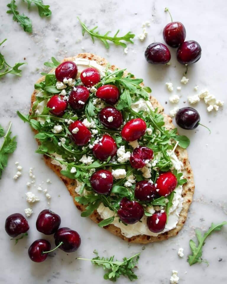 Chickpea Flour Flatbread with Cherries, Honey Ricotta, Feta, and Arugula Recipe