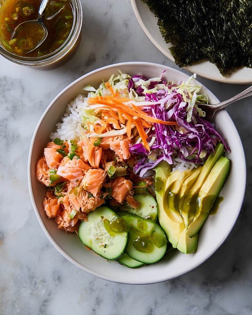 A round white bowl sits on a white marbled surface filled with four distinct layers arranged side by side. The bottom left section holds small white rice grains topped with orange-pink cubes of cooked salmon mixed lightly with green onion bits. Next to it, on the lower center, there are thin green cucumber slices lightly drizzled with a green sauce. The bottom right section has smooth, pale green avocado slices. The top half layer of the bowl contains a mix of shredded purple cabbage, white cabbage, and orange carrot strips, adding bright colors and texture contrast. In the background, a partial view of a white plate with seaweed sheets and a jar of sauce with a spoon is visible. Photo taken with an iphone --ar 4:5 --v 7