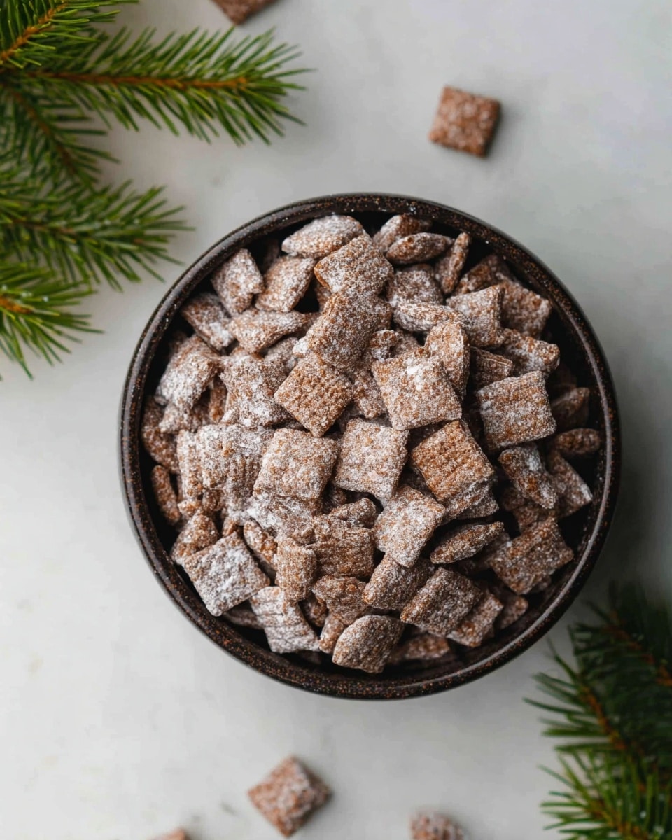A dark round bowl filled with many small, square-shaped cereal pieces coated in powdered sugar, giving them a light dusting of white on the brown surface. The cereal pieces are piled up high, almost to the edge of the bowl. Some cereal squares are scattered outside the bowl on the white marbled surface, adding to the casual arrangement. In the lower left part of the image, green pine leaves add a fresh touch to the setting. Photo taken with an iphone --ar 4:5 --v 7