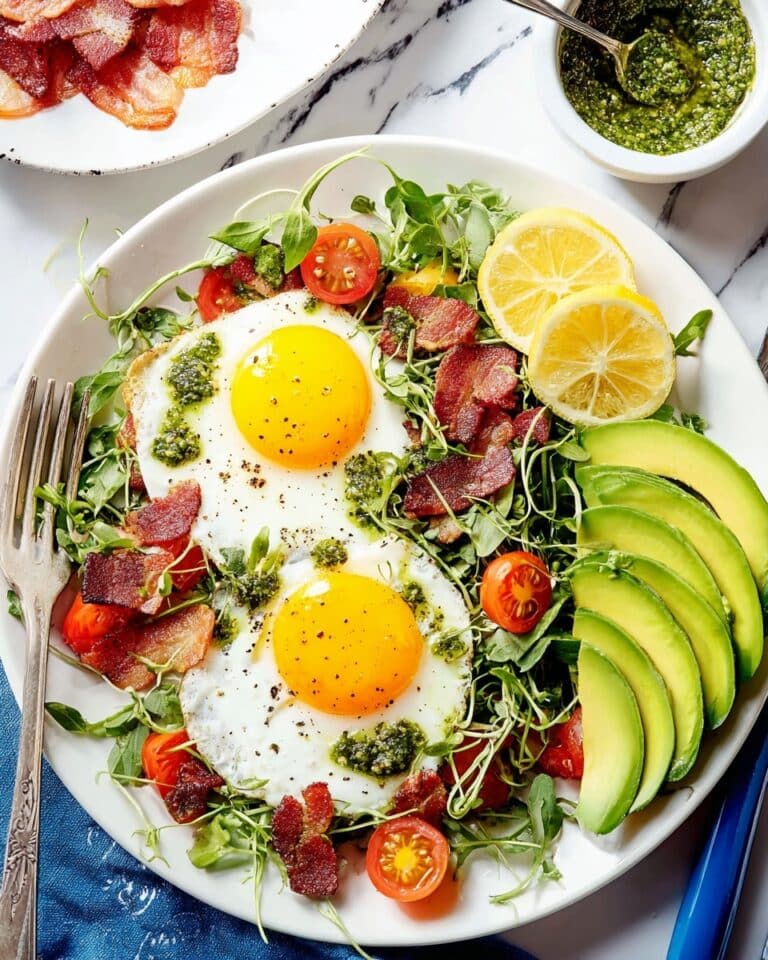 Breakfast Salad with Crispy Bacon, Microgreens, Cherry Tomatoes, and Sunny Side Up Eggs Recipe