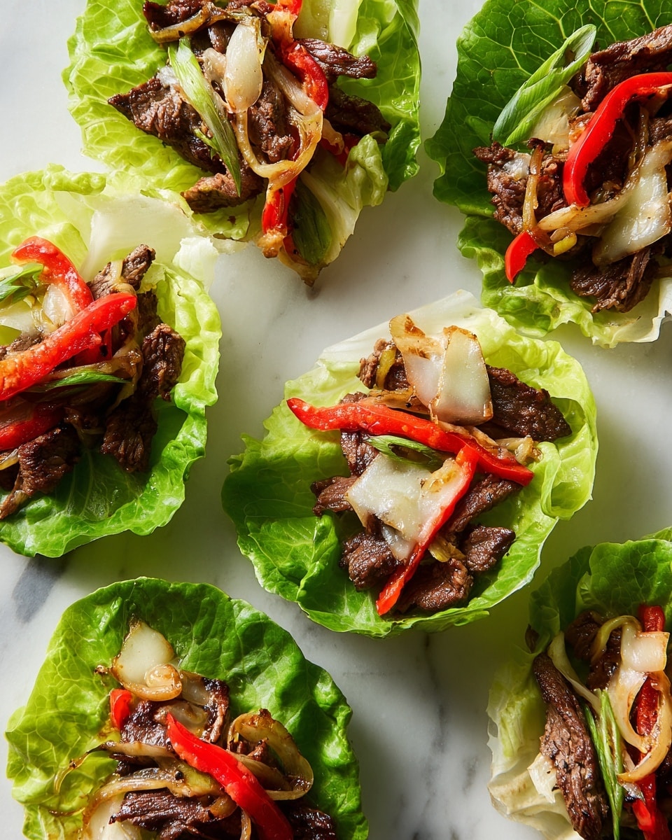 Several lettuce wraps are arranged on a white marbled surface, each wrap made with a fresh, bright green leaf of lettuce forming a cup. Inside each cup, there is a layer of cooked dark brown beef strips mixed with thin slices of sautéed red bell peppers and translucent grilled onions. On top of the beef and vegetables, there are melted pale yellow cheese patches, slightly browned in spots, giving a warm, gooey texture. The wraps are open-faced, except one that is partially rolled, showing the filling inside. The light highlights the glossy, tender texture of the meat and the crispness of the lettuce. photo taken with an iphone --ar 4:5 --v 7