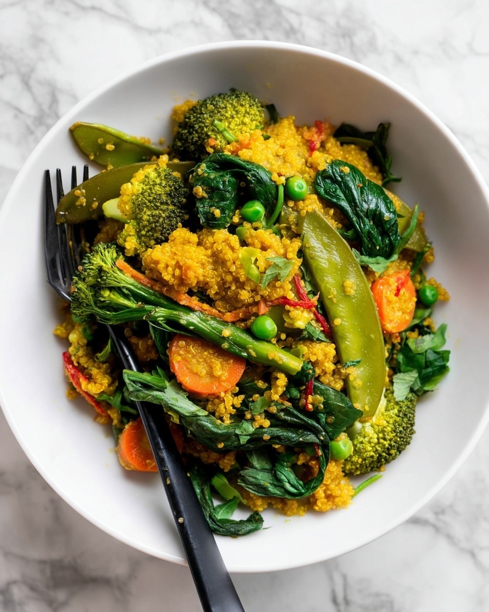 A white bowl filled with a colorful mix of cooked quinoa and vegetables sits on a white marbled surface. The dish has about three layers: the quinoa forms a golden yellow base with a slightly grainy texture, topped with bright green broccoli florets and snap peas, and scattered pieces of orange carrot slices. Fresh, wilted dark green spinach leaves add texture and height to the mix. A black fork rests on the left side of the bowl, partially covered by the food. photo taken with an iphone --ar 4:5 --v 7